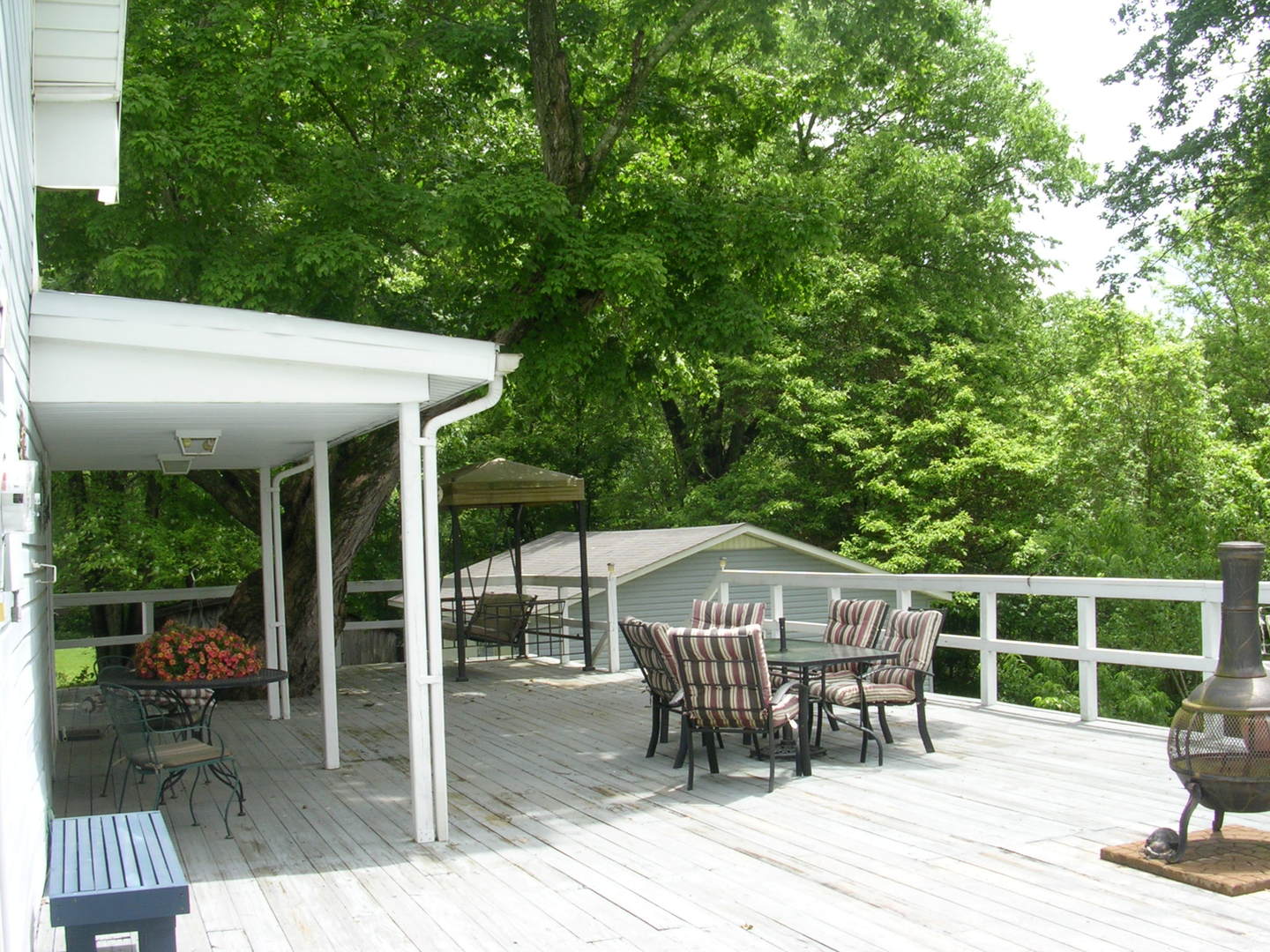 125 Central Hill Road Grantsburg, IL 62943 - Photo 7 of 21 a view of a dinning table and chairs in the patio
