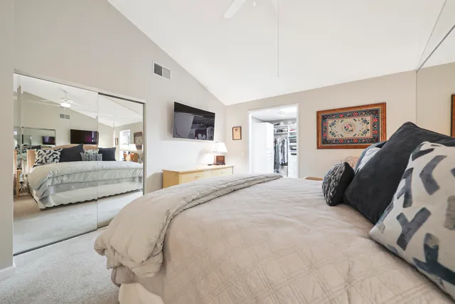 a spacious bathroom with a granite countertop double vanity sink mirror and