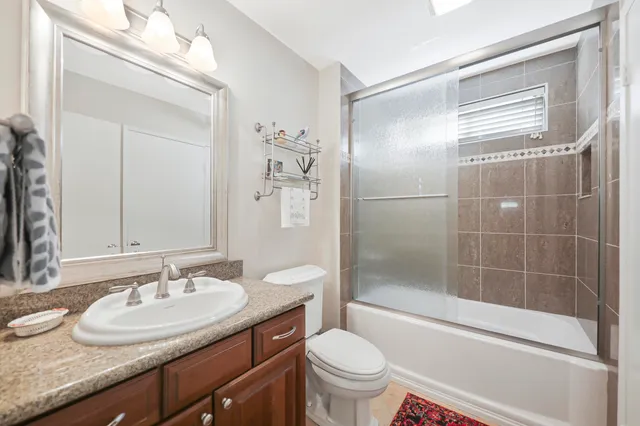 a view of a house with a yard and potted plants