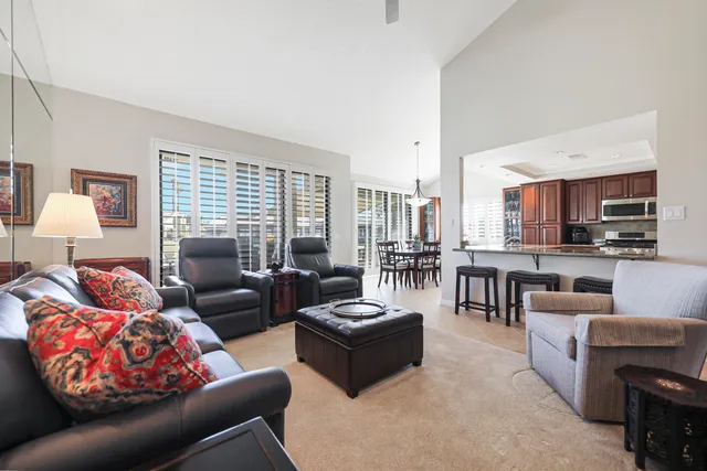 a view of a dining room with furniture and window