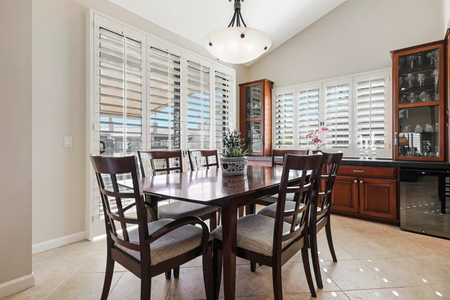 a view of a a dining room with furniture window and outside view