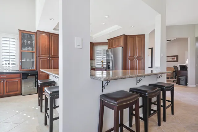 a kitchen with stainless steel appliances granite countertop a stove and a microwave