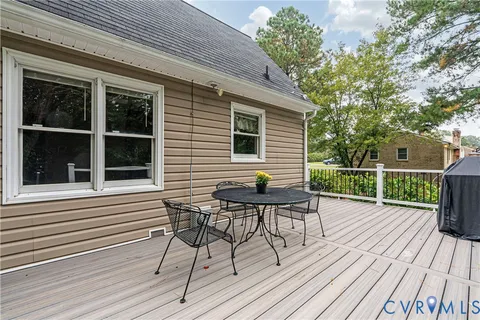 a view of a deck with table and chairs and wooden floor