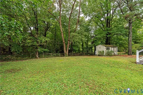 a house with trees in the background