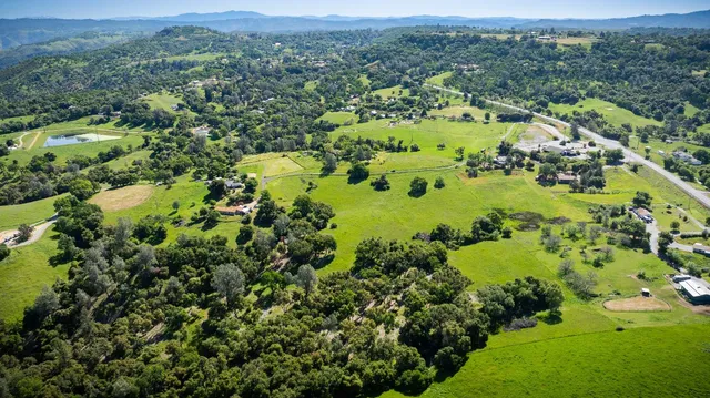 a view of a swimming pool with a yard