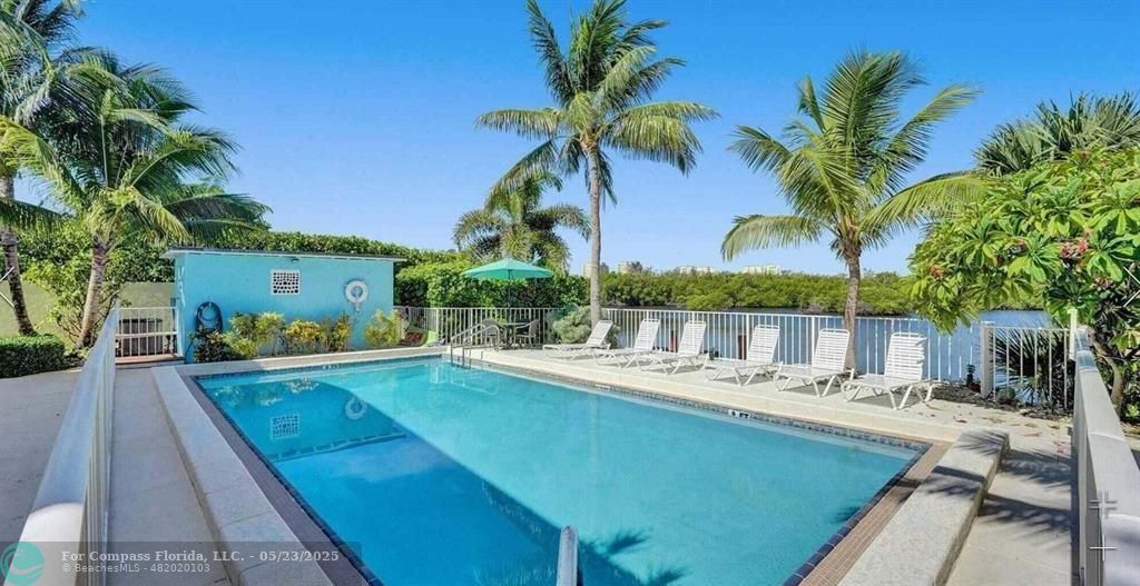 6520 North Ocean Boulevard, Unit 22 Boynton Beach, FL 33435 - Photo 22 of 27 a view of a swimming pool with a patio