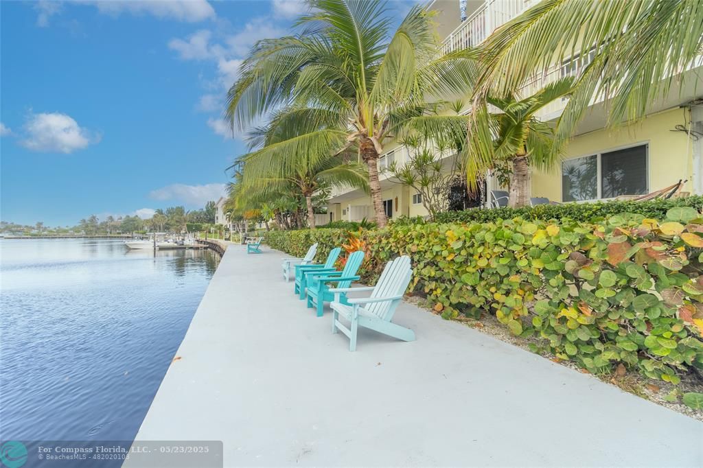 6520 North Ocean Boulevard, Unit 22 Boynton Beach, FL 33435 - Photo 23 of 27 a view of a lake with a patio