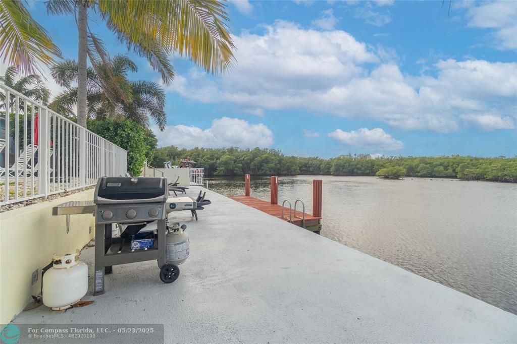 6520 North Ocean Boulevard, Unit 22 Boynton Beach, FL 33435 - Photo 24 of 27 a view of a lake with couches chair and dinning table