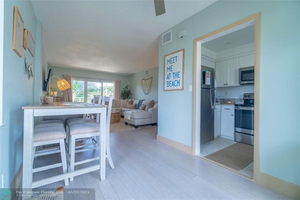 6520 North Ocean Boulevard, Unit 22 Boynton Beach, FL 33435 - Photo 4 of 27 a living room with furniture and a table