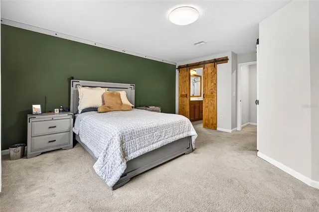 a bathroom with a sink a mirror a vanity and a shower