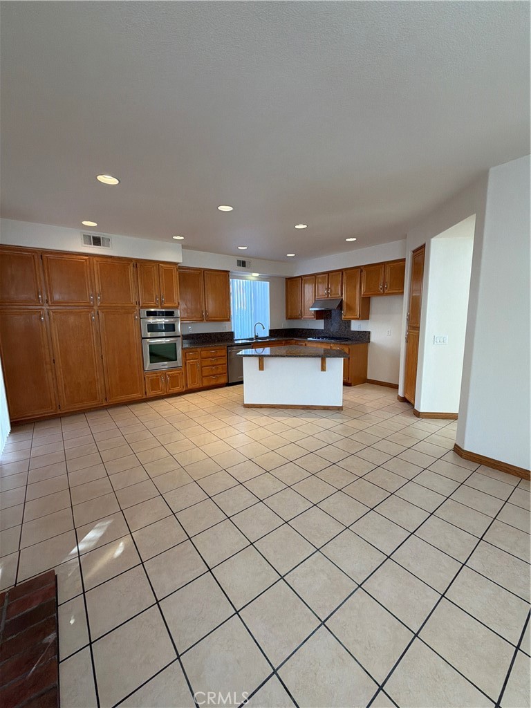 17 Pastora Lake Forest, CA 92610 - Photo 27 of 53 a kitchen with stainless steel appliances a refrigerator and a stove top oven
