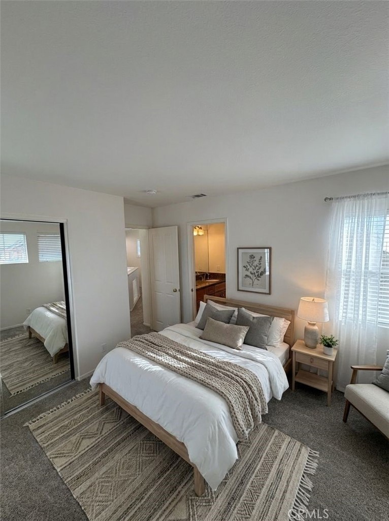 17 Pastora Lake Forest, CA 92610 - Photo 29 of 53 a bedroom with a bed and wooden floor