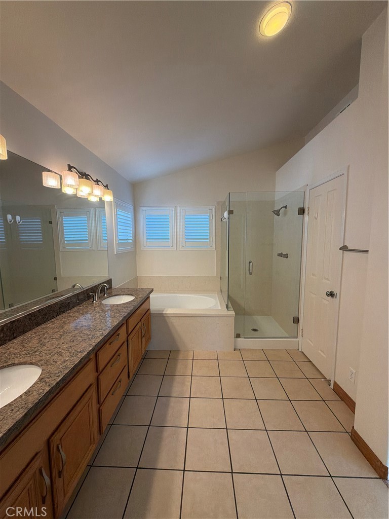 17 Pastora Lake Forest, CA 92610 - Photo 40 of 53 a large bathroom with a granite countertop sink a mirror and a shower