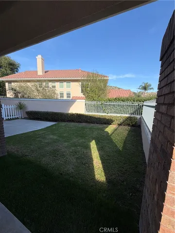 a view of a swimming pool with a yard