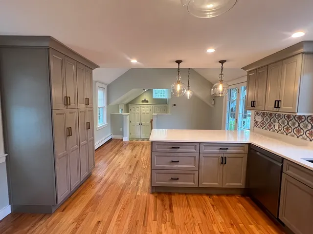 a spacious bathroom with a sink and a mirror