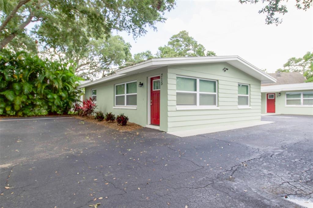 715 Bay Street Dunedin, FL 34698 - Photo 1 of 19 a front view of a house with porch