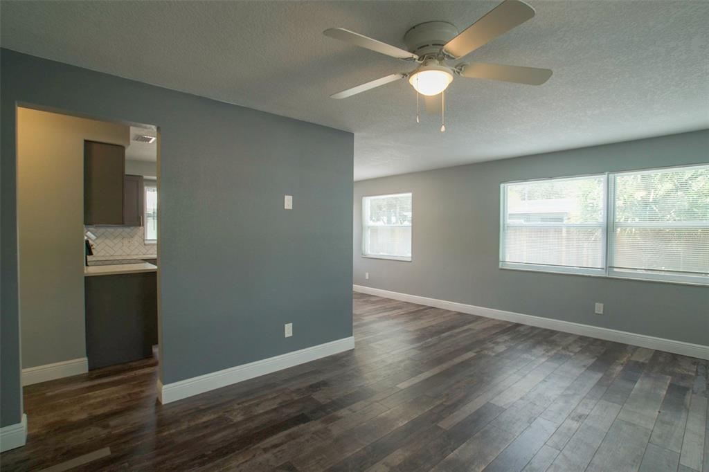 715 Bay Street Dunedin, FL 34698 - Photo 12 of 19 an empty room with wooden floor and windows