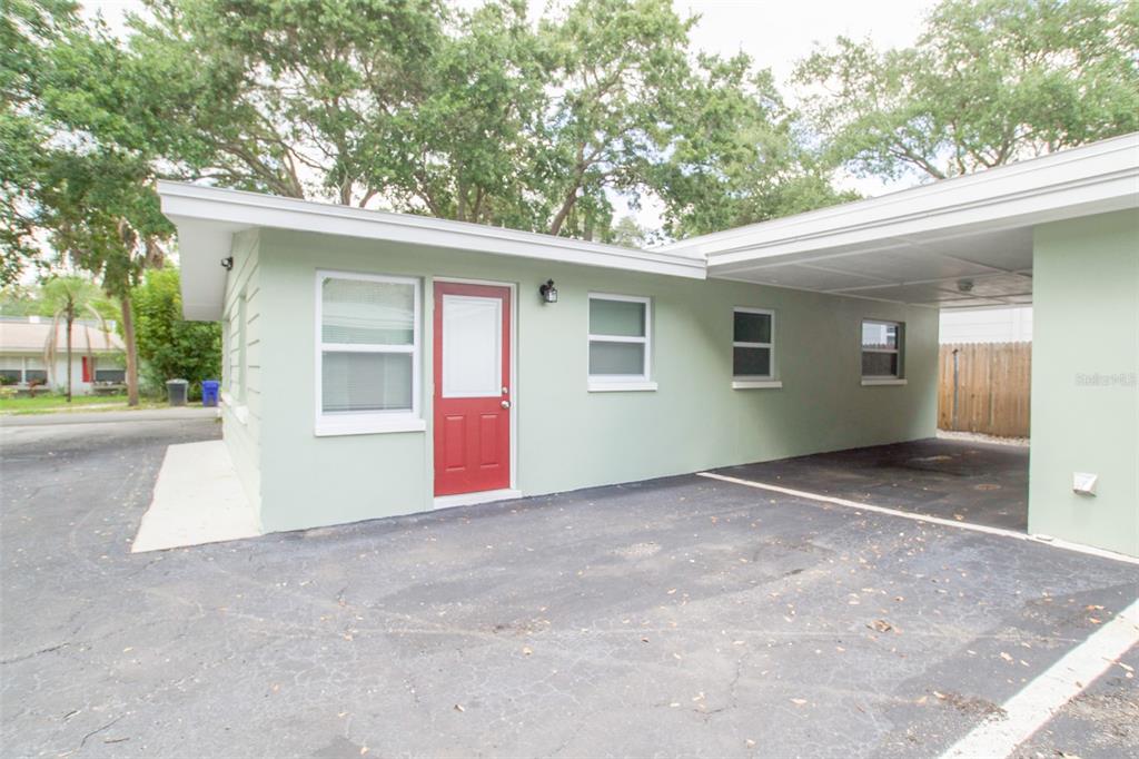 715 Bay Street Dunedin, FL 34698 - Photo 18 of 19 a view of a house with a garage