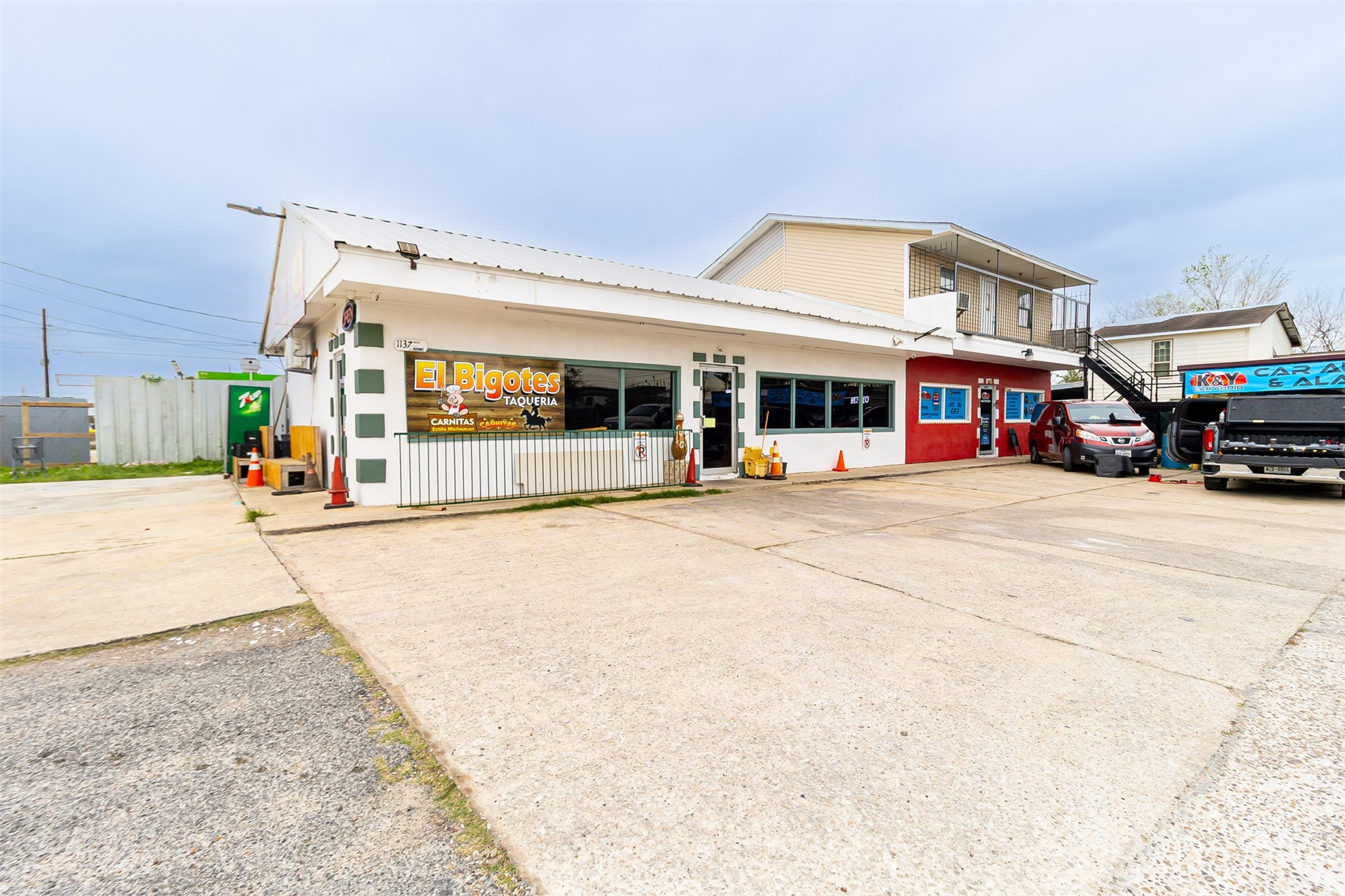 a view of a building with car parked