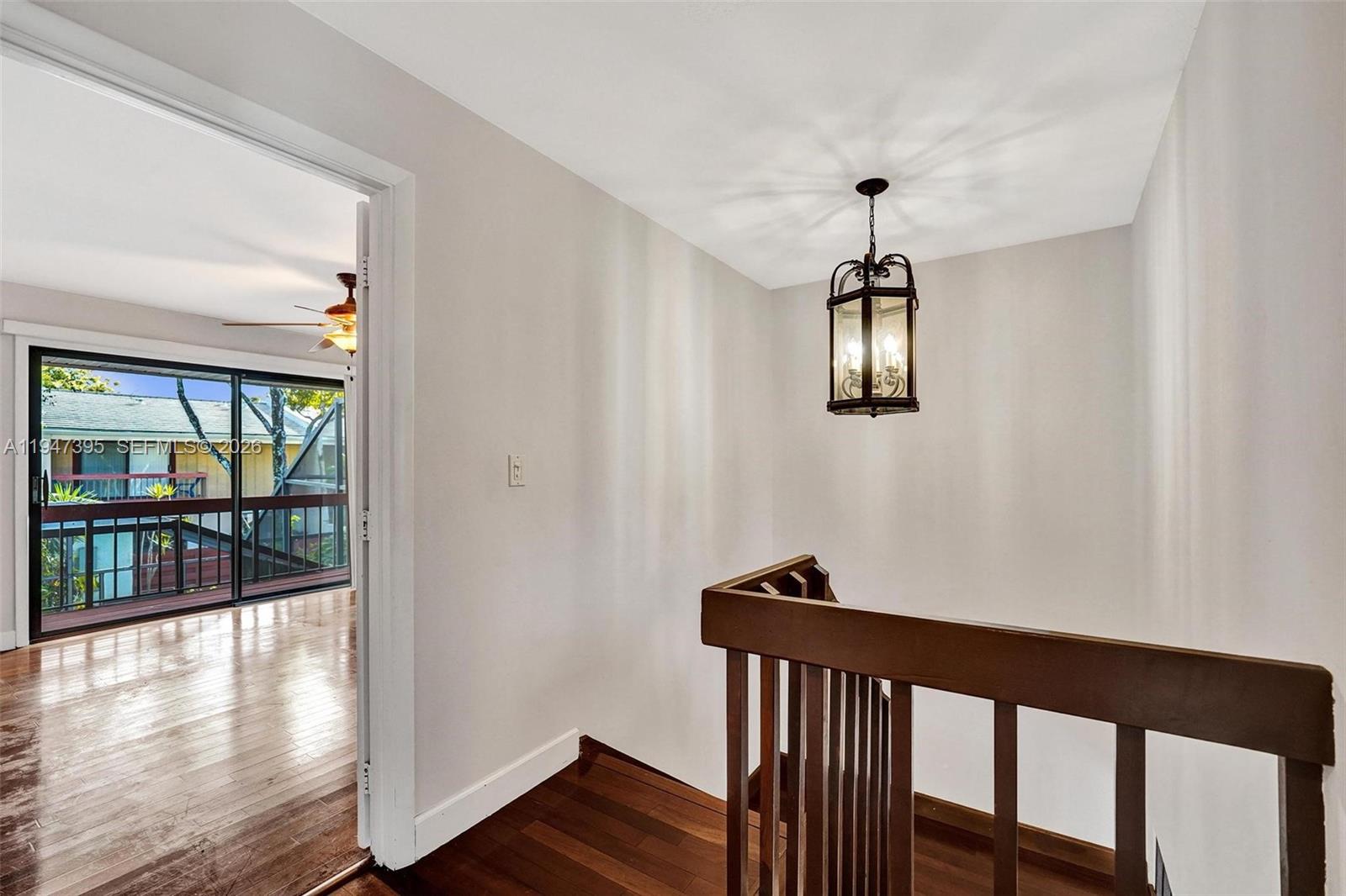 2990 Oaktree Lane, Unit 338 Hollywood, FL 33021 - Photo 12 of 24 a view of entryway with wooden floor and chandelier