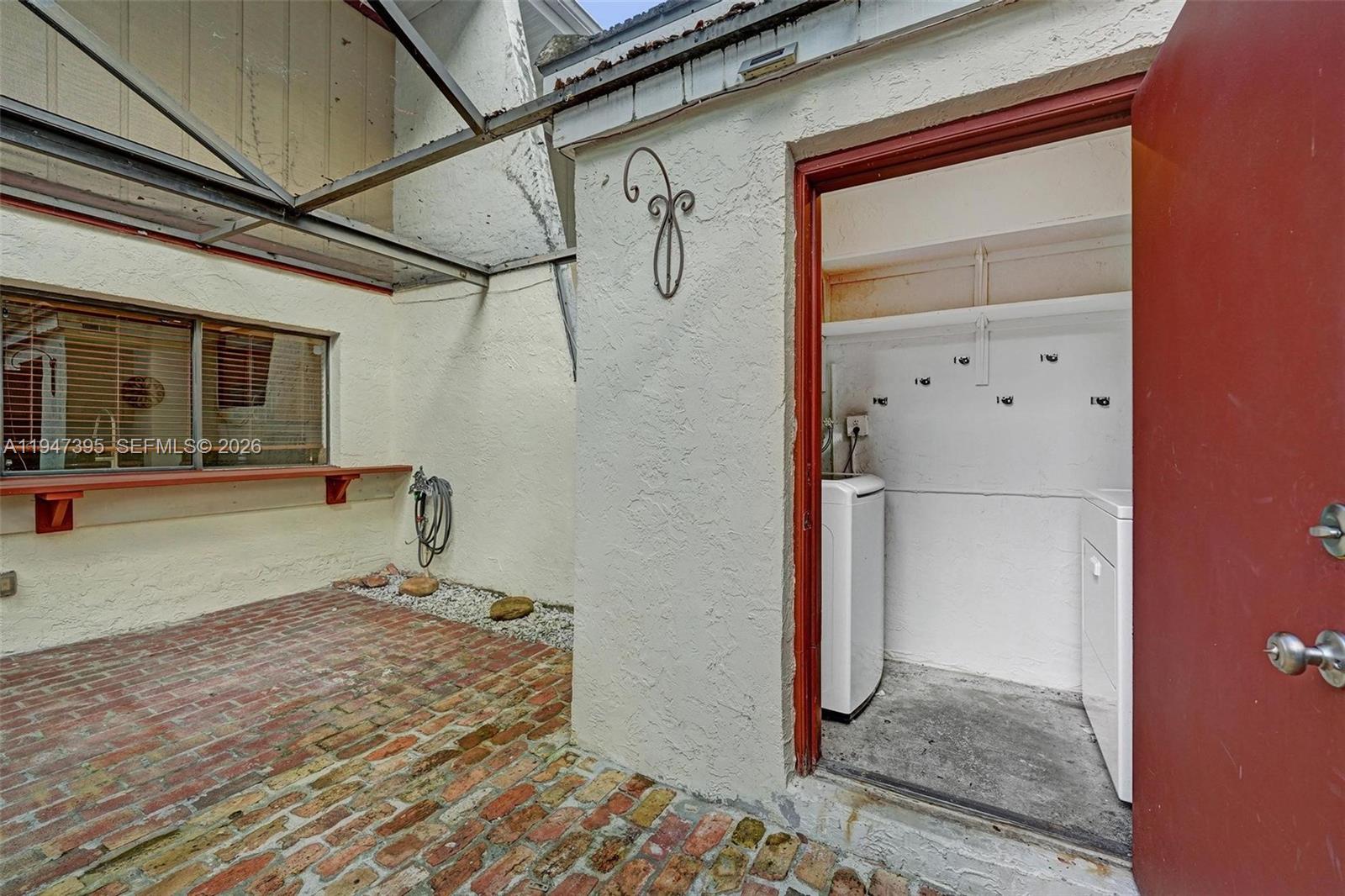 2990 Oaktree Lane, Unit 338 Hollywood, FL 33021 - Photo 21 of 24 a bedroom with a bed and a mirror