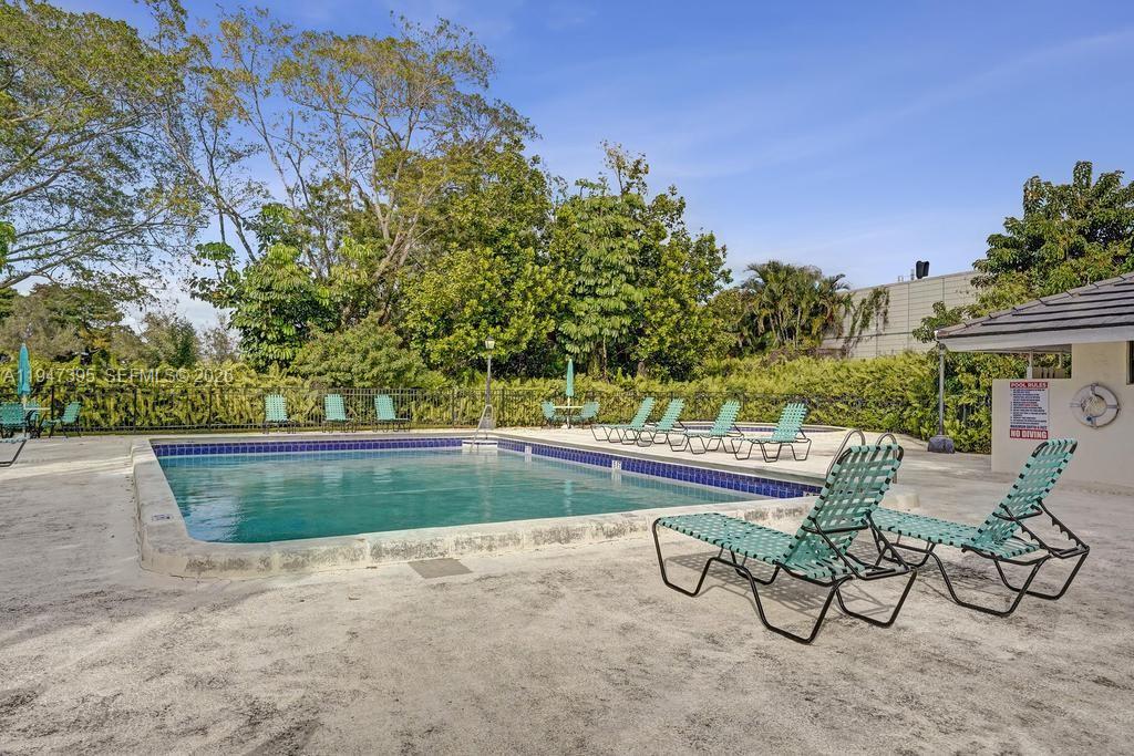 2990 Oaktree Lane, Unit 338 Hollywood, FL 33021 - Photo 23 of 24 a view of swimming pool with seating space