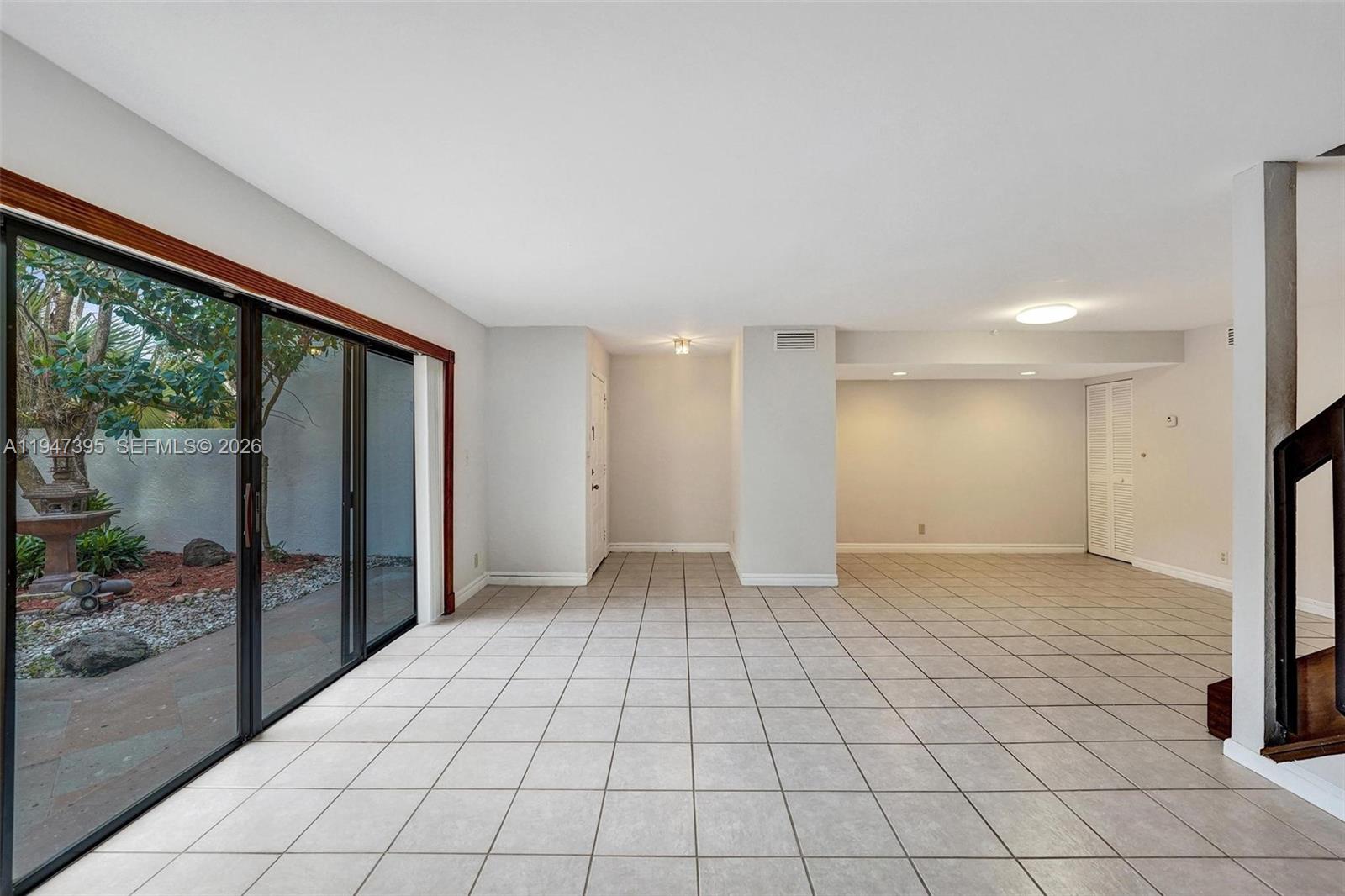 2990 Oaktree Lane, Unit 338 Hollywood, FL 33021 - Photo 6 of 24 a view of empty room with wooden floor and fan