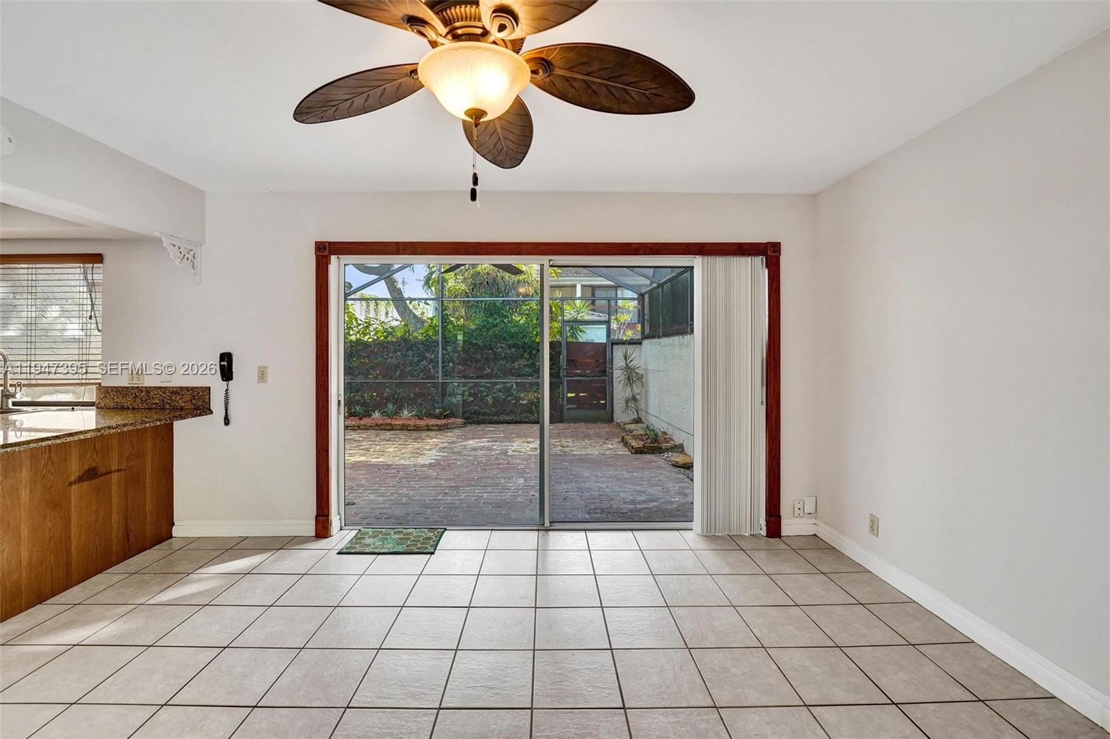 2990 Oaktree Lane, Unit 338 Hollywood, FL 33021 - Photo 10 of 24 a view of an empty room and window a kitchen area