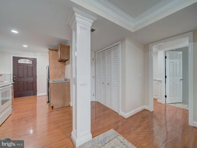 wooden floor with room and windows