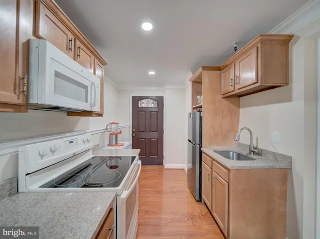 a kitchen that has a sink and a stove
