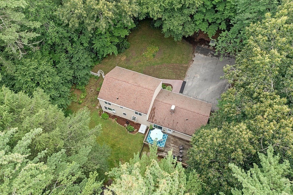 69 Hill Road Groton, MA 01450 - Photo 12 of 42 an aerial view of a house with a yard and lake view
