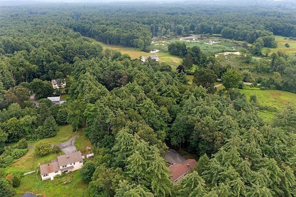 69 Hill Road Groton, MA 01450 - Photo 14 of 42 an aerial view of residential houses with outdoor space and trees