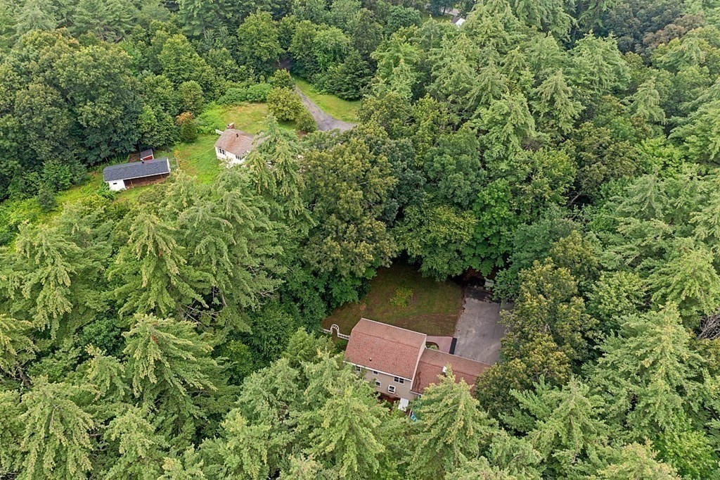 69 Hill Road Groton, MA 01450 - Photo 16 of 42 an aerial view of a house with a yard and tree s