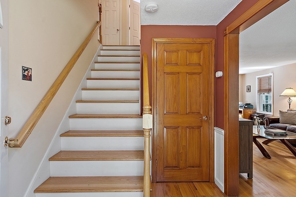 69 Hill Road Groton, MA 01450 - Photo 19 of 42 a view of an entryway with wooden floor