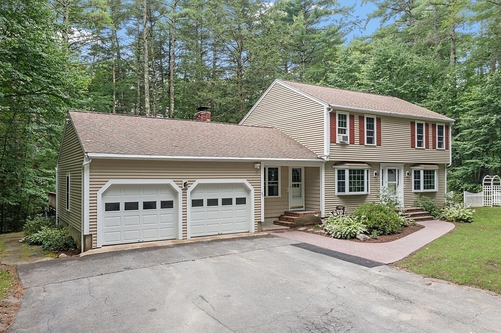 69 Hill Road Groton, MA 01450 - Photo 2 of 42 front view of a house with a street