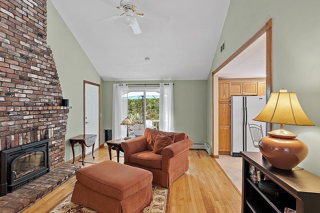 69 Hill Road Groton, MA 01450 - Photo 23 of 42 a living room with furniture and a fireplace