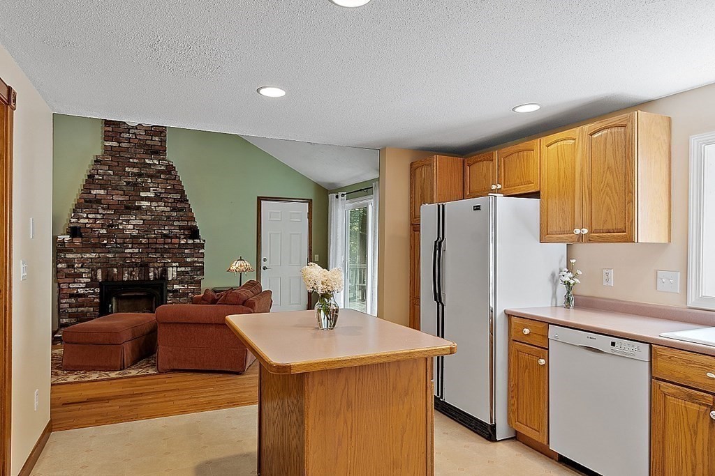 69 Hill Road Groton, MA 01450 - Photo 26 of 42 a kitchen with a sink refrigerator and cabinets