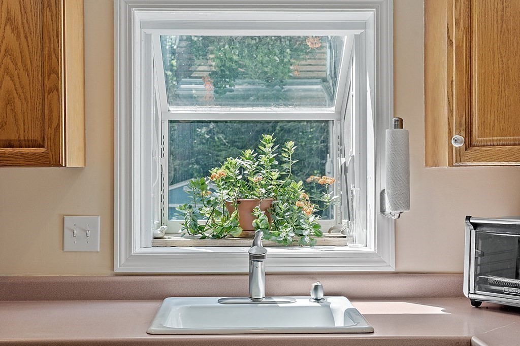69 Hill Road Groton, MA 01450 - Photo 27 of 42 a white sink sitting in front of a window