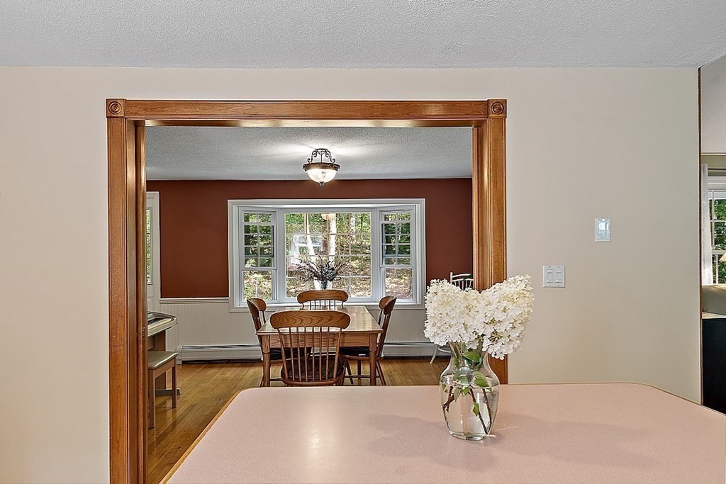69 Hill Road Groton, MA 01450 - Photo 28 of 42 a view of a livingroom with furniture window and outside view