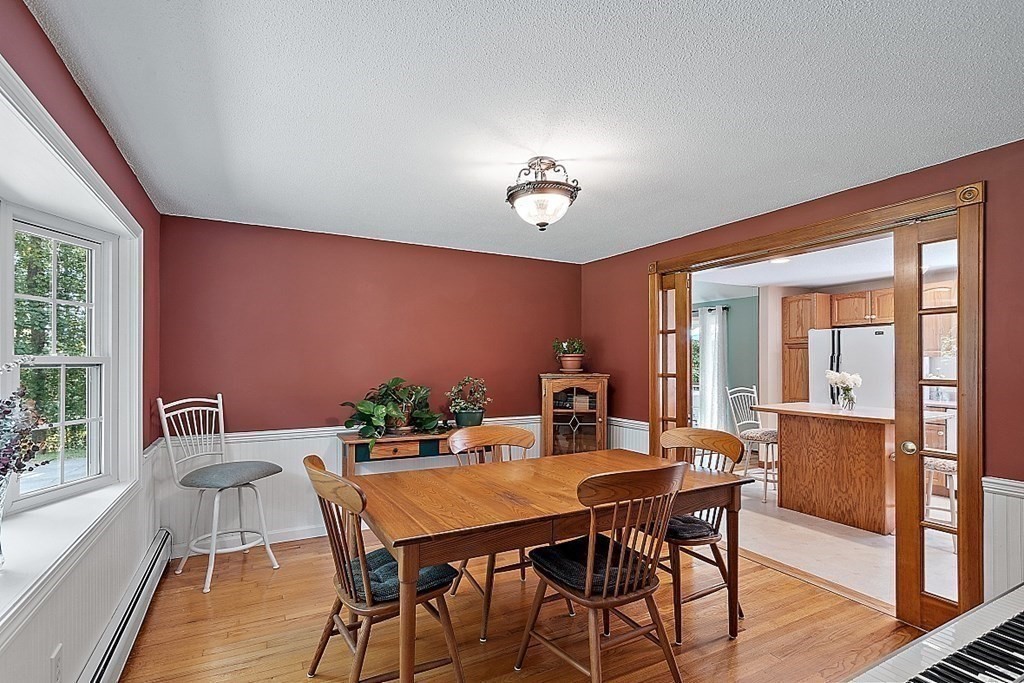 69 Hill Road Groton, MA 01450 - Photo 29 of 42 a view of a dining room with furniture window and wooden floor