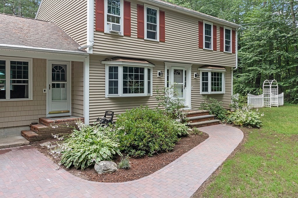 69 Hill Road Groton, MA 01450 - Photo 3 of 42 a view of a house with potted plants