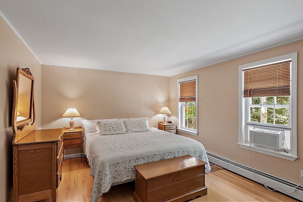 69 Hill Road Groton, MA 01450 - Photo 34 of 42 a bedroom with a bed and window
