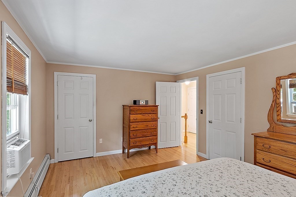 69 Hill Road Groton, MA 01450 - Photo 35 of 42 a view of room with wooden floor and chair