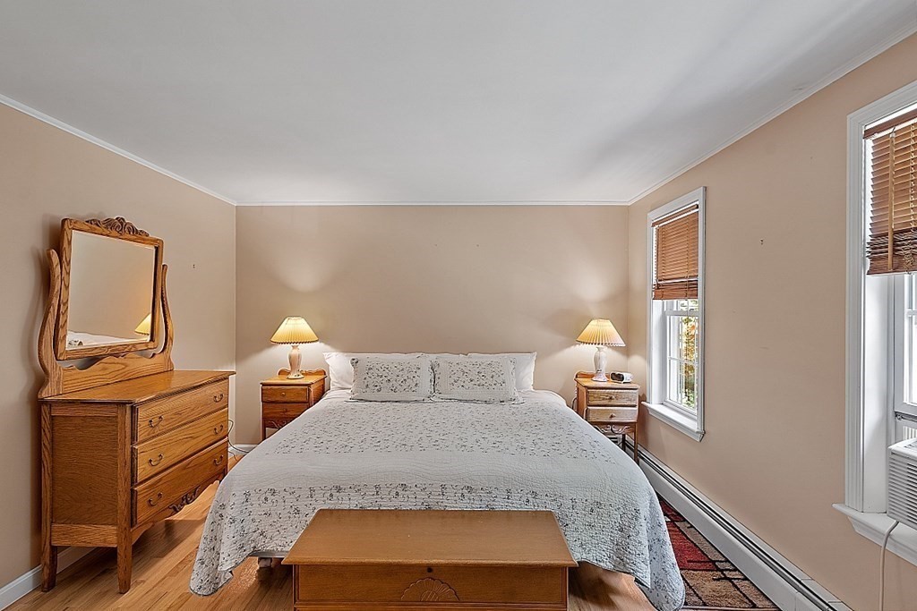 69 Hill Road Groton, MA 01450 - Photo 36 of 42 a bedroom with a bed and window