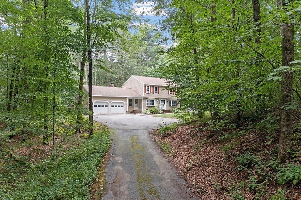 69 Hill Road Groton, MA 01450 - Photo 5 of 42 a view of a house with a yard