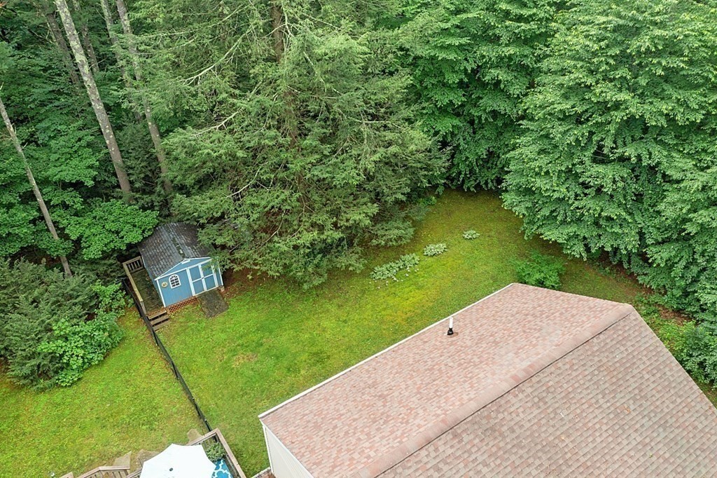 69 Hill Road Groton, MA 01450 - Photo 9 of 42 a view of a backyard