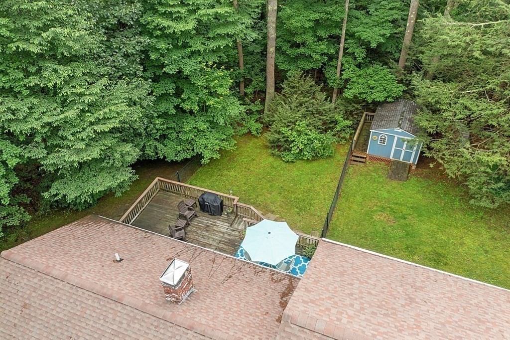 69 Hill Road Groton, MA 01450 - Photo 10 of 42 a view of a two chairs in a yard