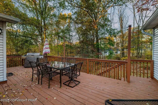a living room with furniture and floor to ceiling windows