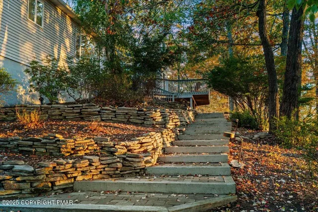 a living room with furniture a fireplace and a table