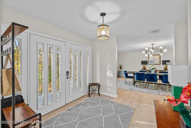 a white bath tub sitting in a bathroom next to a window